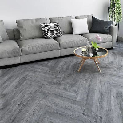 An image of a   Athens Collection SPC Flooring Herringbone Grey Tint by LONGTERM house floor